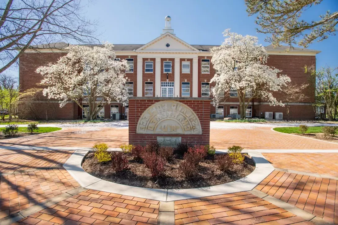 Founders Hall in the spring with Dogwood blossoms